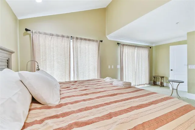 a view of staircase with railing and white walls
