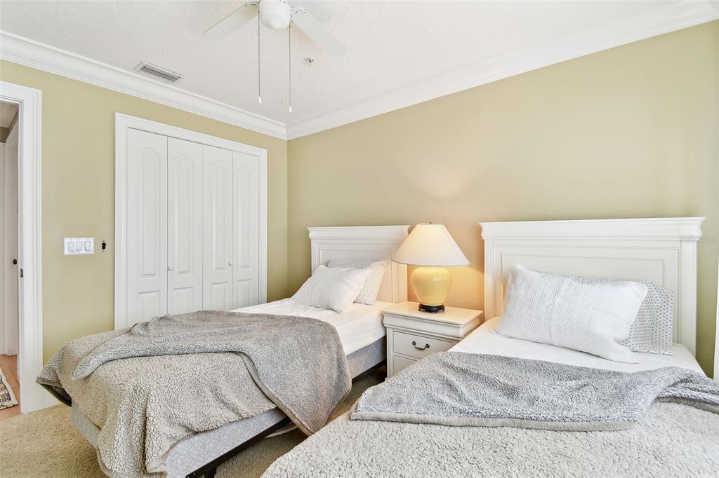 16033 Gulf Boulevard Redington Beach, FL 33708 - Photo 47 of 98 a bedroom with a bed and a lamp