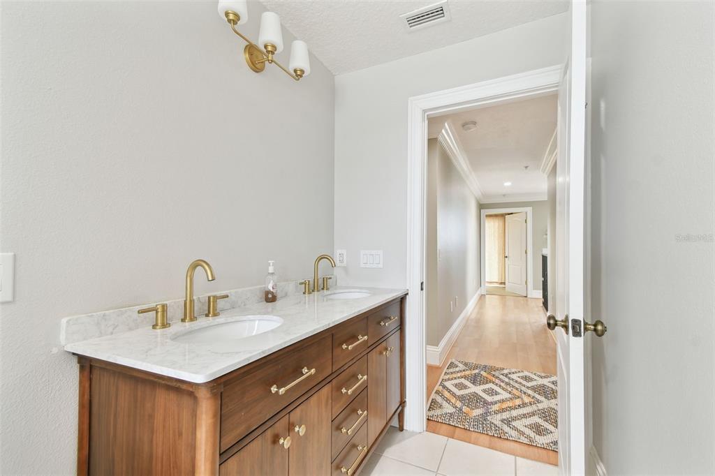 16033 Gulf Boulevard Redington Beach, FL 33708 - Photo 54 of 98 a bathroom with a sink and a mirror