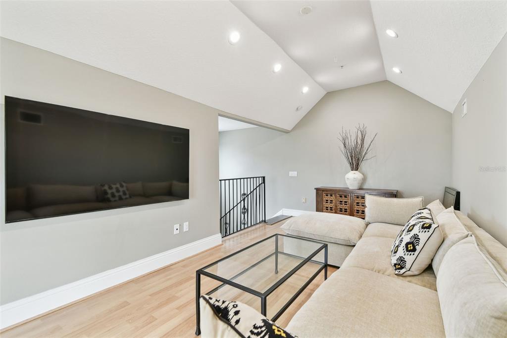 16033 Gulf Boulevard Redington Beach, FL 33708 - Photo 65 of 98 a living room with furniture and a flat screen tv