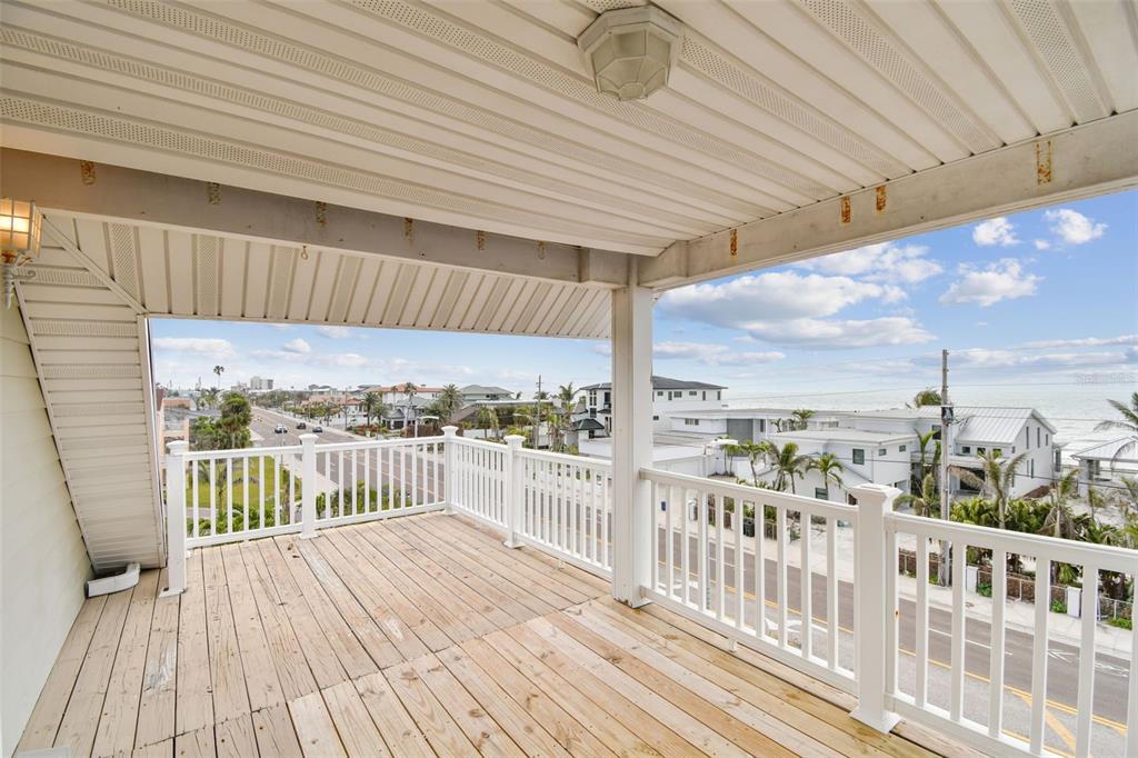 16033 Gulf Boulevard Redington Beach, FL 33708 - Photo 69 of 98 a view of a balcony with wooden floor