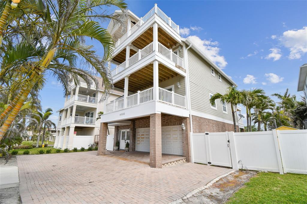 16033 Gulf Boulevard Redington Beach, FL 33708 - Photo 83 of 98 a view of a house with a yard and garage