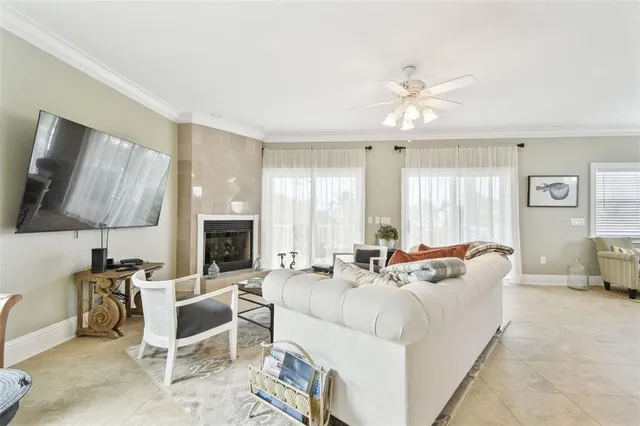a dining room with furniture potted plants and wooden floor