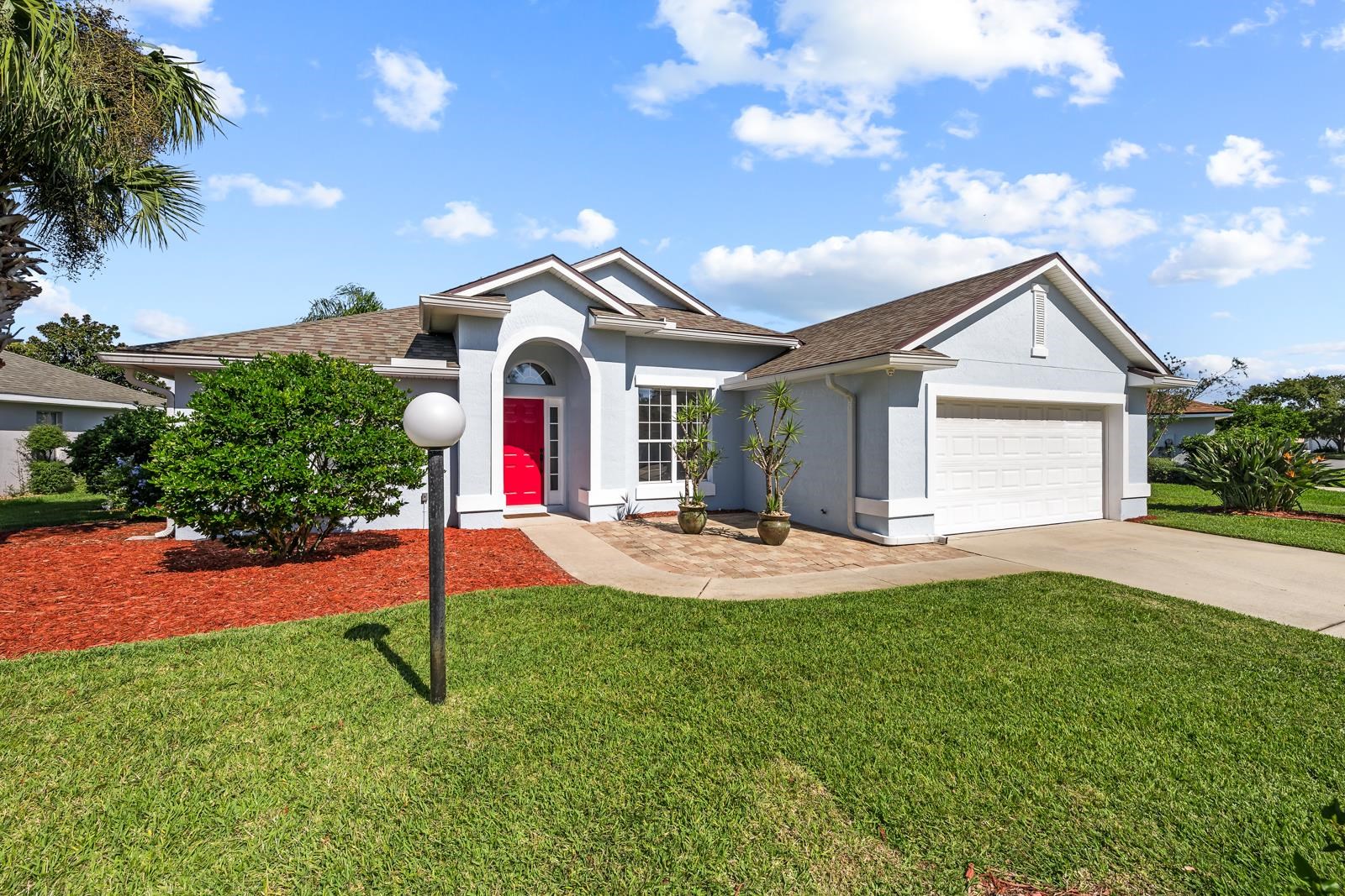 1116 Compass Row St. Augustine, FL 32080 - Photo 1 of 68 Ranch-style house with stucco siding, concrete driveway, a front yard, a shingled roof, and an attached garage