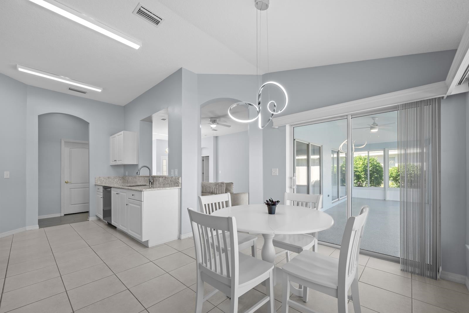 1116 Compass Row St. Augustine, FL 32080 - Photo 21 of 68 Breakfast featuring arched walkways, light tile patterned floors, and ceiling fan