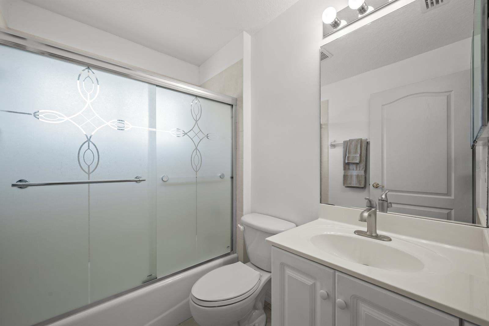 1116 Compass Row St. Augustine, FL 32080 - Photo 32 of 68 Full bath with vanity and combined bath / shower with glass door