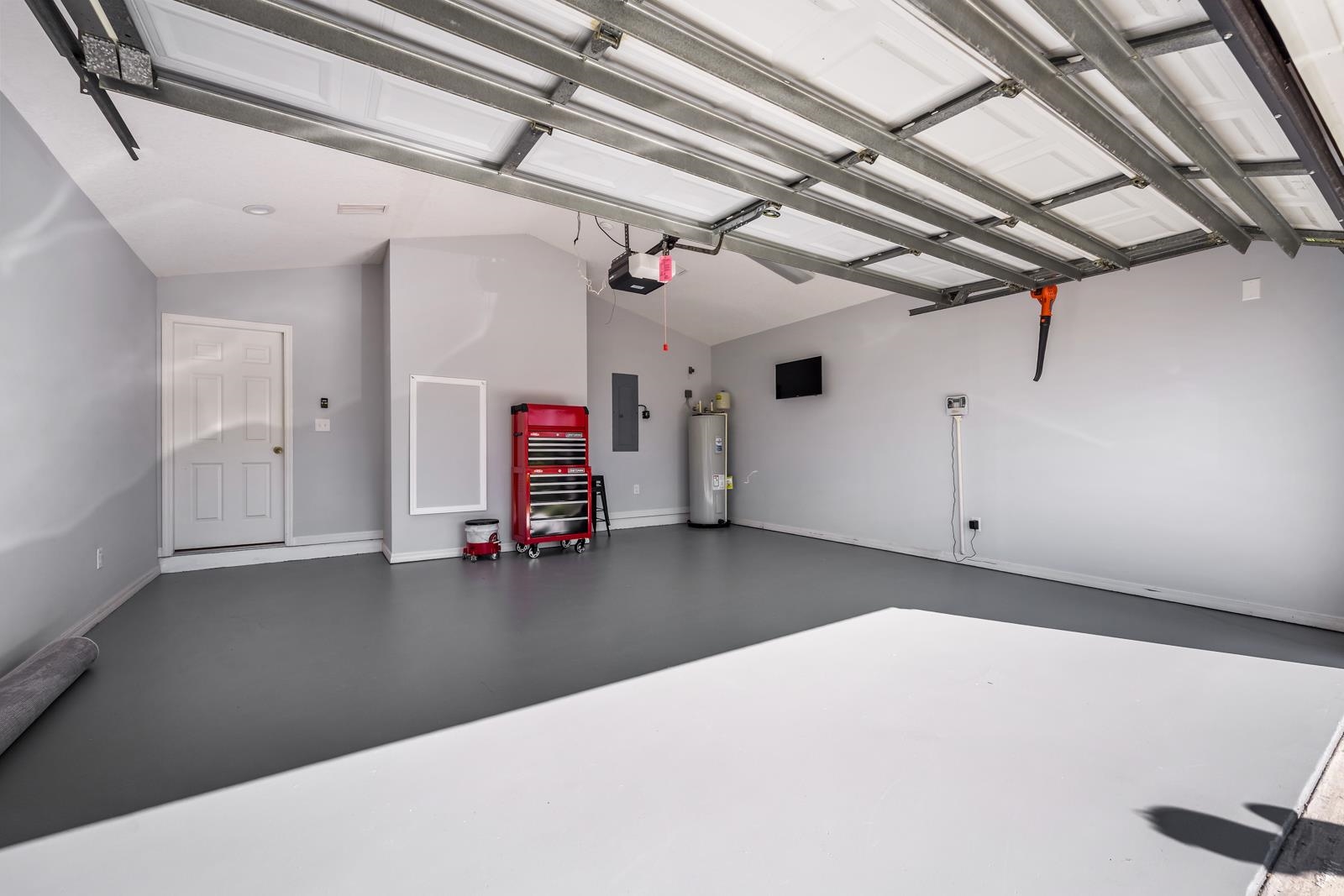 1116 Compass Row St. Augustine, FL 32080 - Photo 35 of 68 Garage featuring electric water heater and electric panel