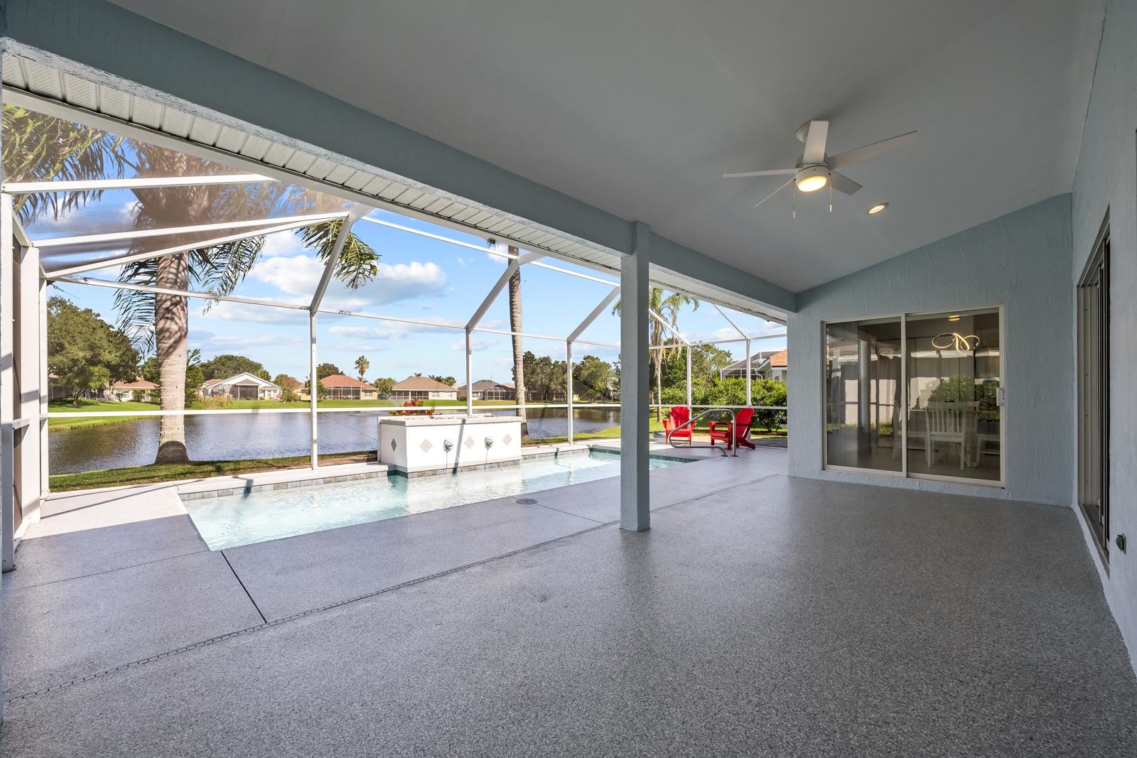 1116 Compass Row St. Augustine, FL 32080 - Photo 38 of 68 Unfurnished sunroom with a patio, a ceiling fan, a water view, vaulted ceiling, and a residential view