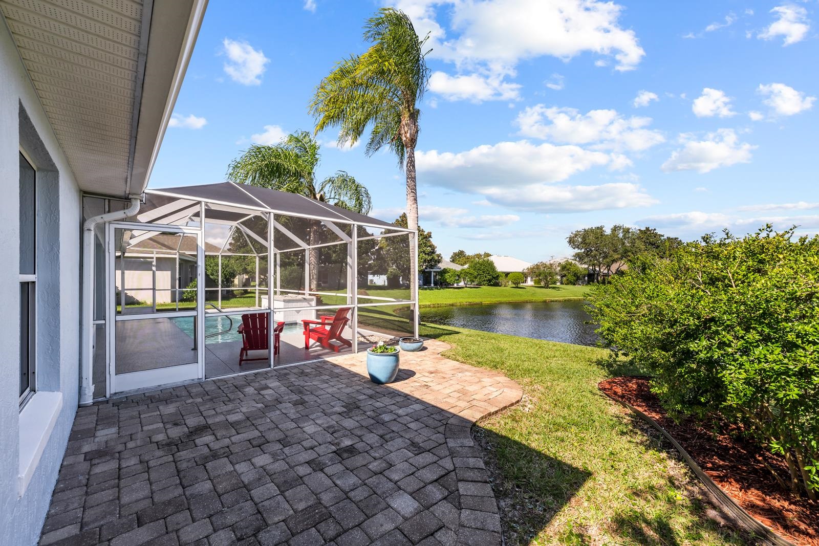 1116 Compass Row St. Augustine, FL 32080 - Photo 45 of 68 View of patio with glass enclosure, a water view, a sunroom, and an outdoor pool
