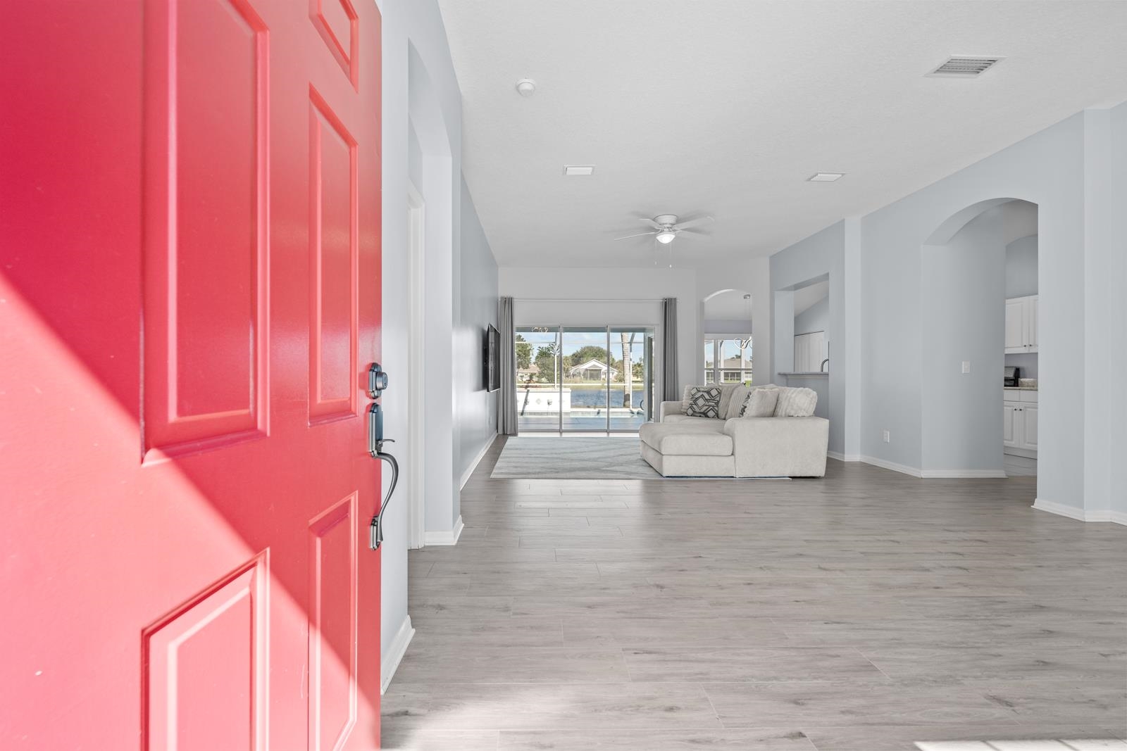 1116 Compass Row St. Augustine, FL 32080 - Photo 5 of 68 Entryway with arched walkways, ceiling fan, and light wood finished floors