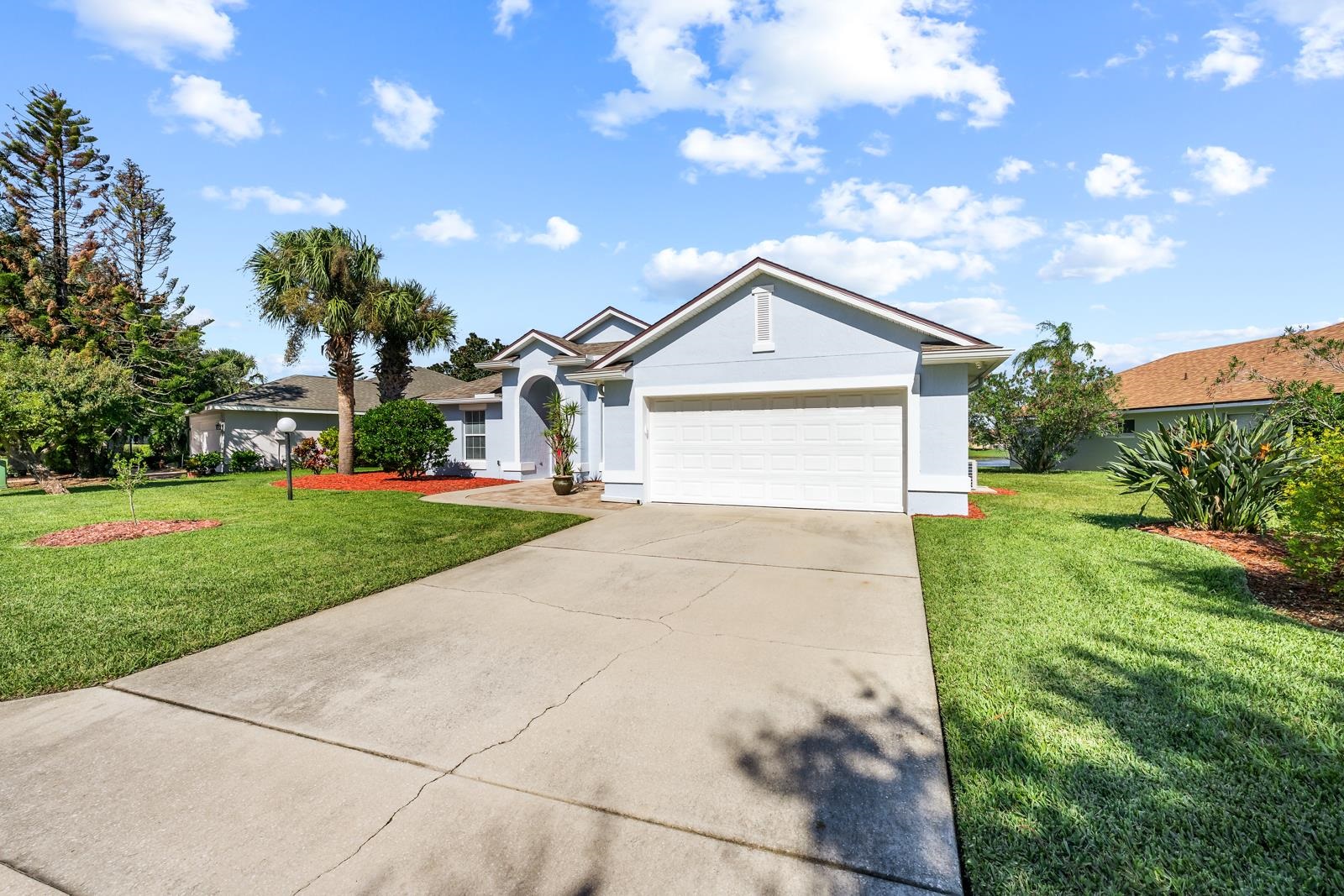 1116 Compass Row St. Augustine, FL 32080 - Photo 51 of 68 Ranch-style house featuring stucco siding, concrete driveway, a front lawn, and a garage