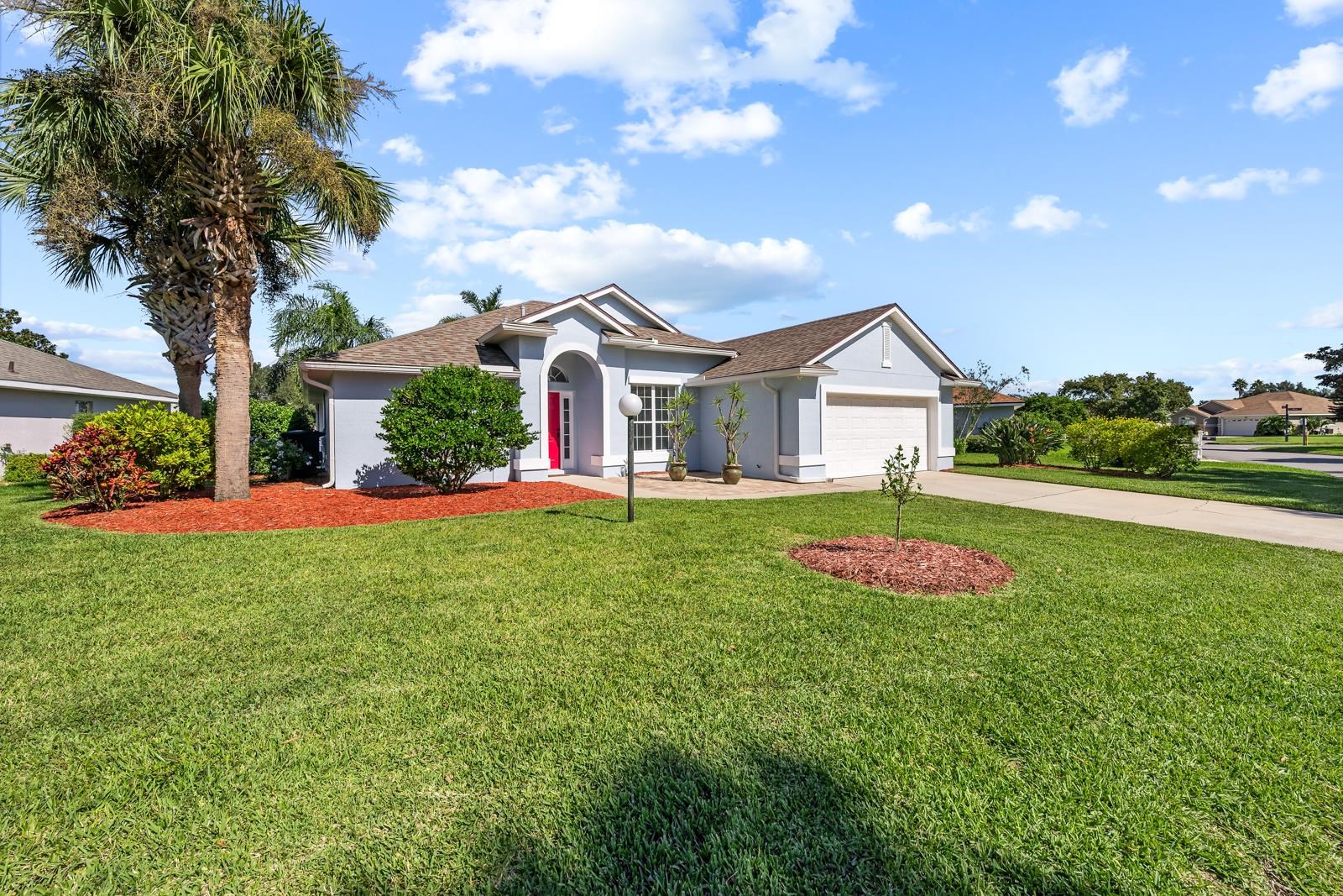 1116 Compass Row St. Augustine, FL 32080 - Photo 53 of 68 Single story home with stucco siding, concrete driveway, a front lawn, a garage, and a shingled roof