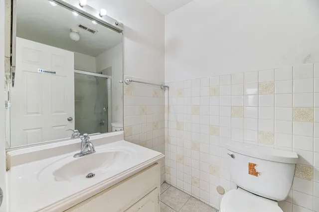 a bathroom with a sink and shower