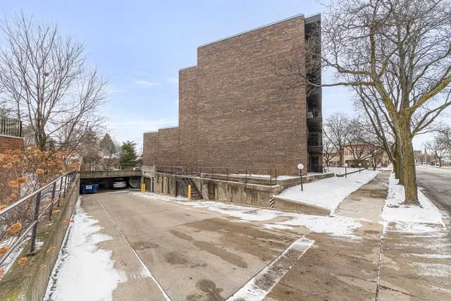 a view of a house with snow on the road