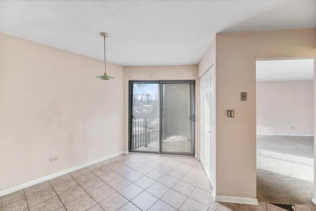 a view of an empty room and window