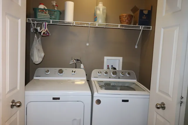a utility room with dryer and washer