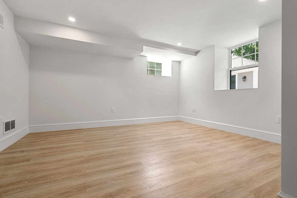 45 Sewall Street Newton, MA 02465 - Photo 8 of 21 a view of an empty room with wooden floor and a window
