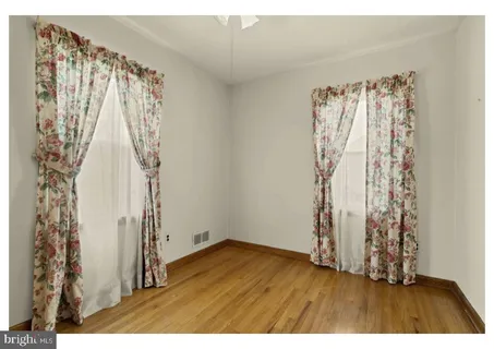a view of a room with wooden floor and walls