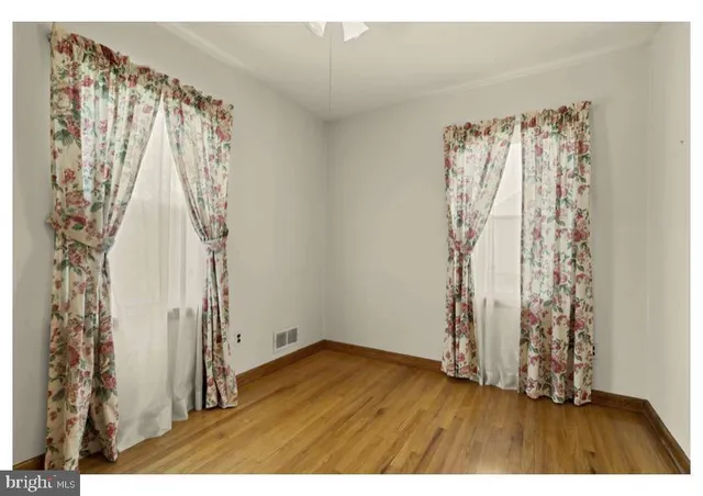 a view of a room with wooden floor and walls