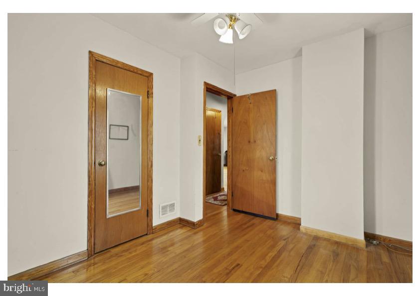 7524 Harmans Road Harmans, MD 21077 - Photo 20 of 40 a view of an empty room with wooden floor