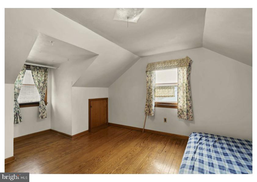 7524 Harmans Road Harmans, MD 21077 - Photo 26 of 40 a view of an empty room with wooden floor and a window