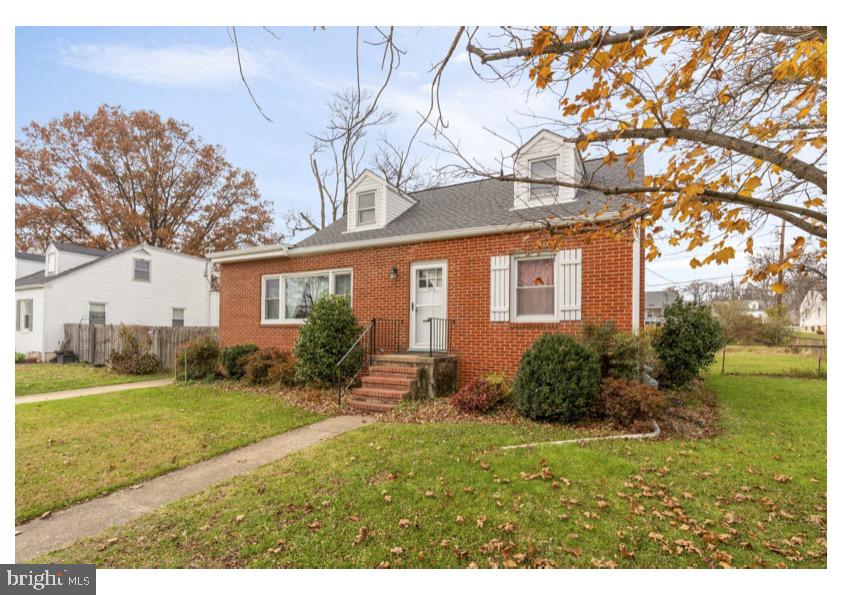 7524 Harmans Road Harmans, MD 21077 - Photo 3 of 40 a front view of a house with garden