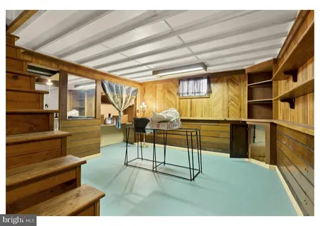 a view of entryway dining room and hall with wooden floor