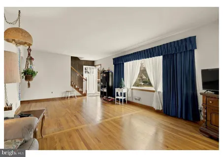 a view of a livingroom with furniture and a flat screen tv