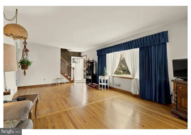 a view of a livingroom with furniture and a flat screen tv