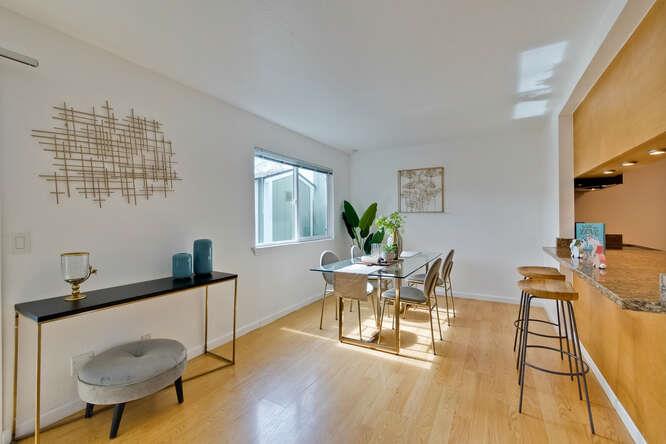 1127 Reed Avenue, Unit B Sunnyvale, CA 94086 - Photo 11 of 58 a view of a dining room with furniture and wooden floor