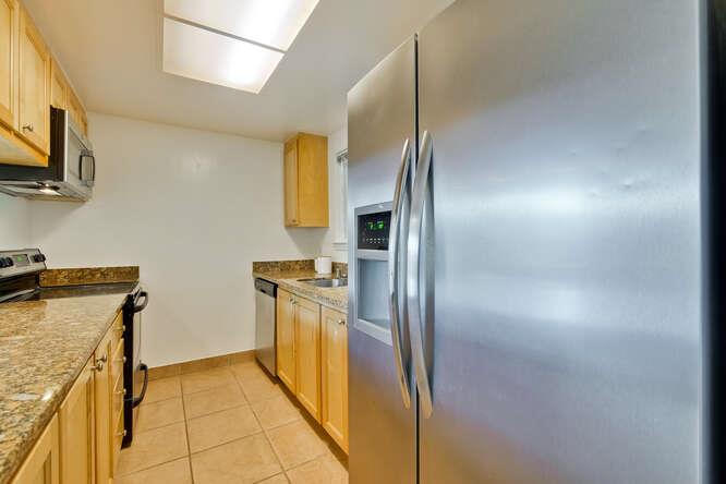 1127 Reed Avenue, Unit B Sunnyvale, CA 94086 - Photo 22 of 58 a kitchen with stainless steel appliances granite countertop a refrigerator and a stove