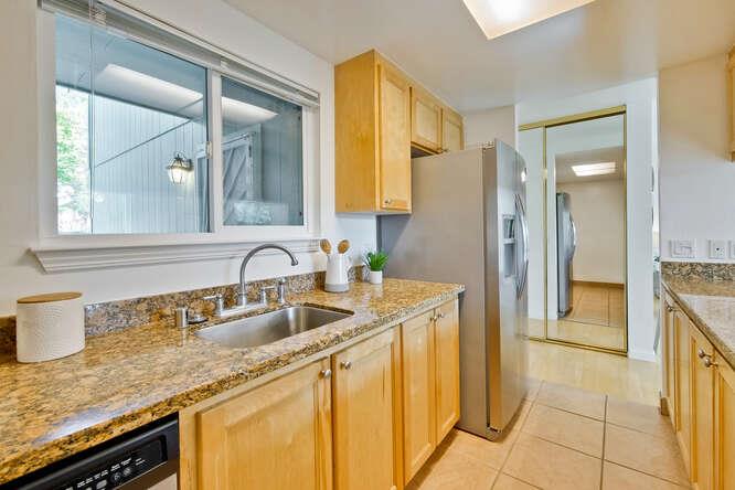 1127 Reed Avenue, Unit B Sunnyvale, CA 94086 - Photo 25 of 58 a bathroom with a granite countertop sink and a mirror
