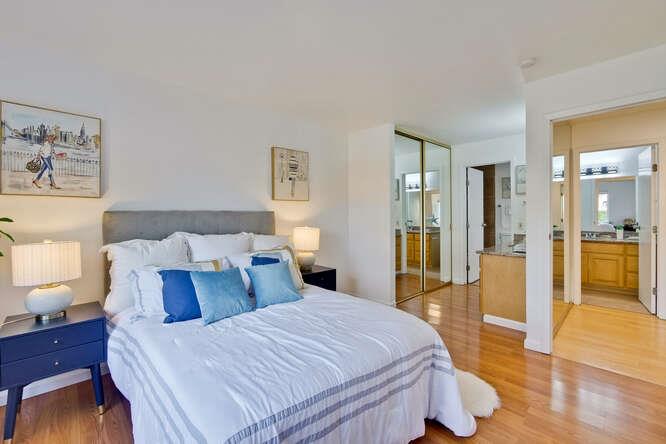 1127 Reed Avenue, Unit B Sunnyvale, CA 94086 - Photo 28 of 58 a bed room with a bed and a view of bathroom
