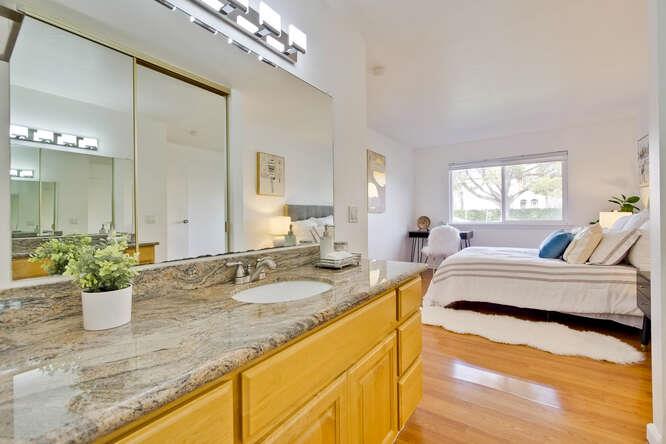 1127 Reed Avenue, Unit B Sunnyvale, CA 94086 - Photo 34 of 58 a spacious bathroom with a granite countertop sink a large mirror and a bathtub