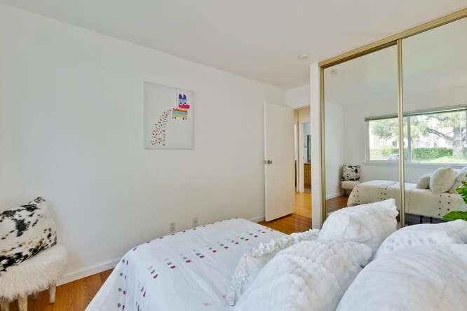 1127 Reed Avenue, Unit B Sunnyvale, CA 94086 - Photo 39 of 58 a bedroom with a bed and a window