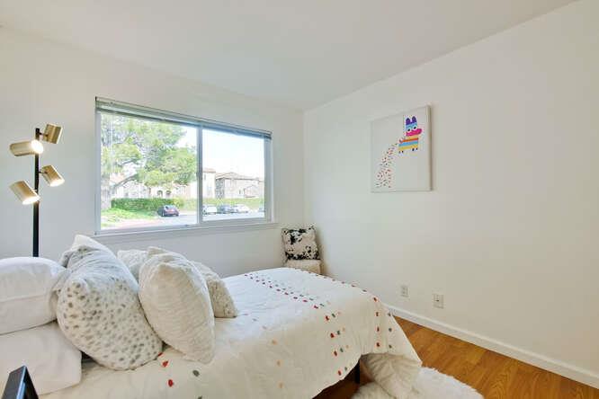 1127 Reed Avenue, Unit B Sunnyvale, CA 94086 - Photo 40 of 58 a bedroom with a bed and a window