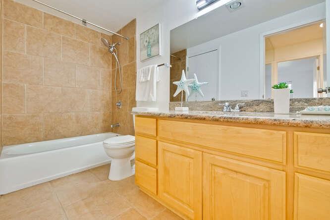1127 Reed Avenue, Unit B Sunnyvale, CA 94086 - Photo 41 of 58 a bathroom with a granite countertop sink toilet and shower