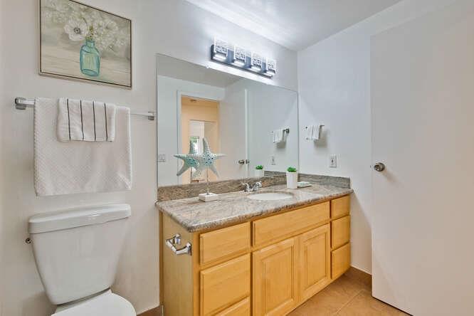 1127 Reed Avenue, Unit B Sunnyvale, CA 94086 - Photo 42 of 58 a bathroom with a granite countertop toilet sink and mirror