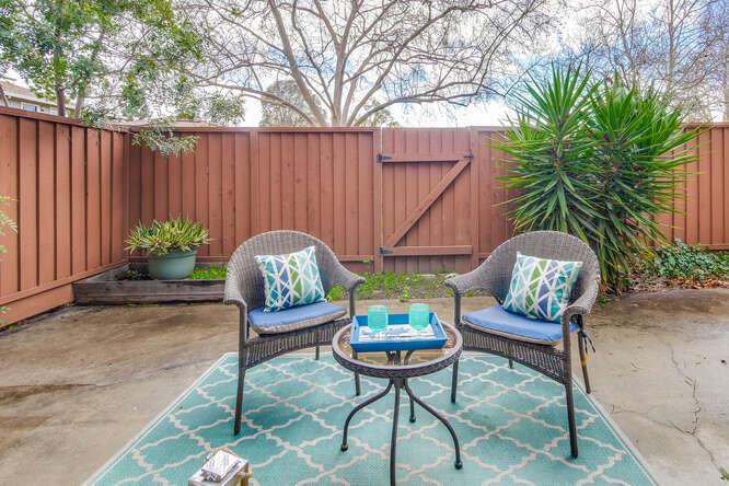 1127 Reed Avenue, Unit B Sunnyvale, CA 94086 - Photo 50 of 58 a backyard of a house with barbeque oven table and chairs