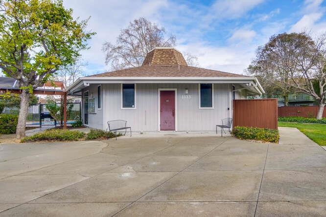 1127 Reed Avenue, Unit B Sunnyvale, CA 94086 - Photo 51 of 58 a front view of a house with a yard and garage