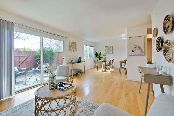 1127 Reed Avenue, Unit B Sunnyvale, CA 94086 - Photo 10 of 58 a living room with furniture and a large window