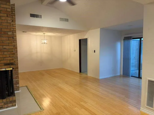 view of a brick house with a door