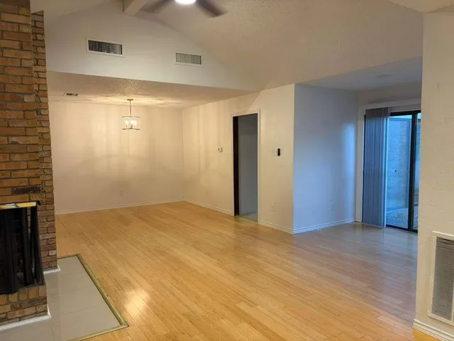 view of a brick house with a door