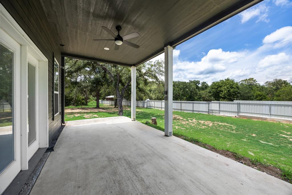 1016 Silver Creek Azle Road Azle, TX 76020 - Photo 38 of 40 Fenced backyard featuring ceiling fan and a patio