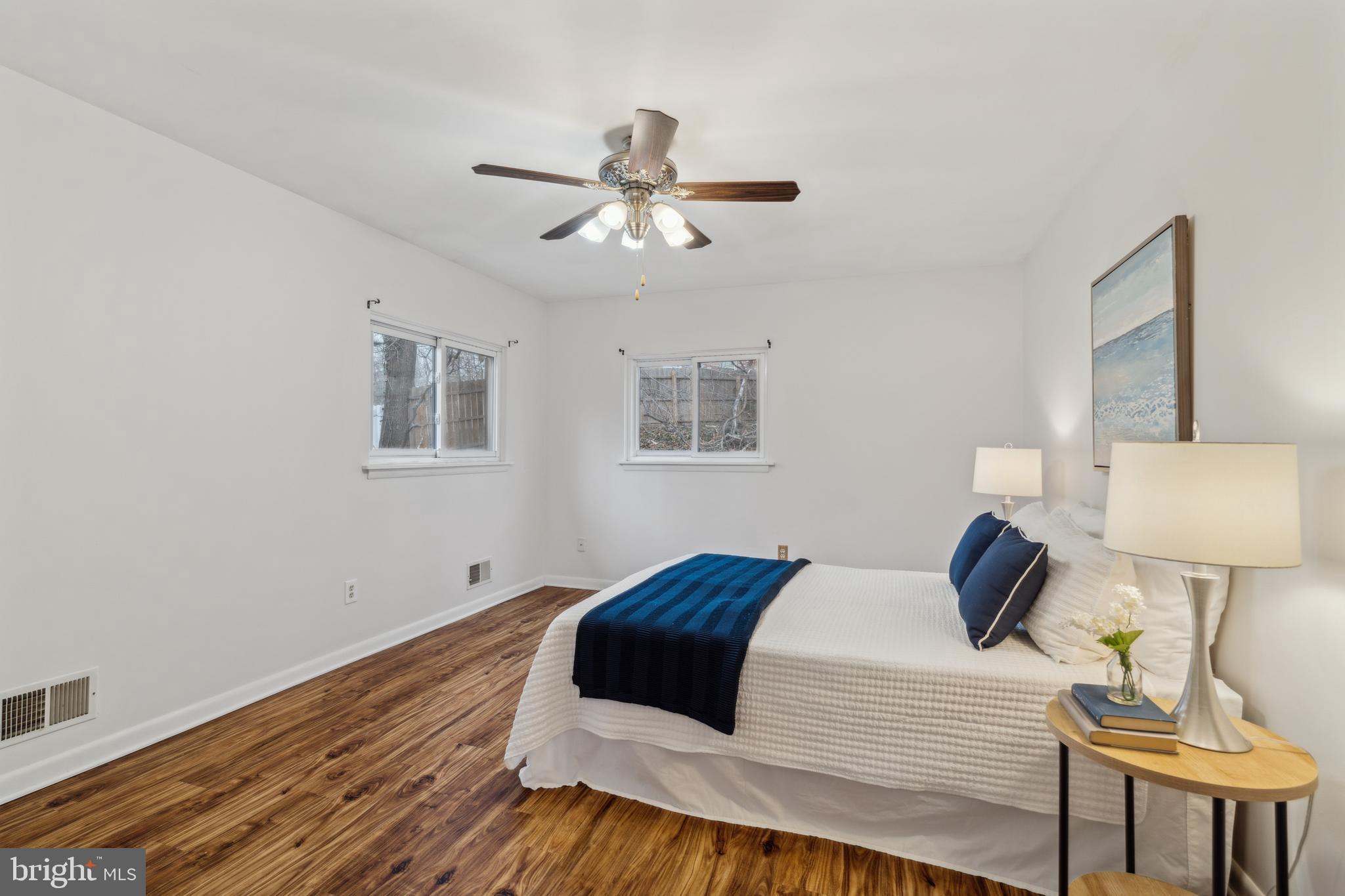 698 Benfield Road Severna Park, MD 21146 - Photo 11 of 28 a bedroom with a bed and wooden floor