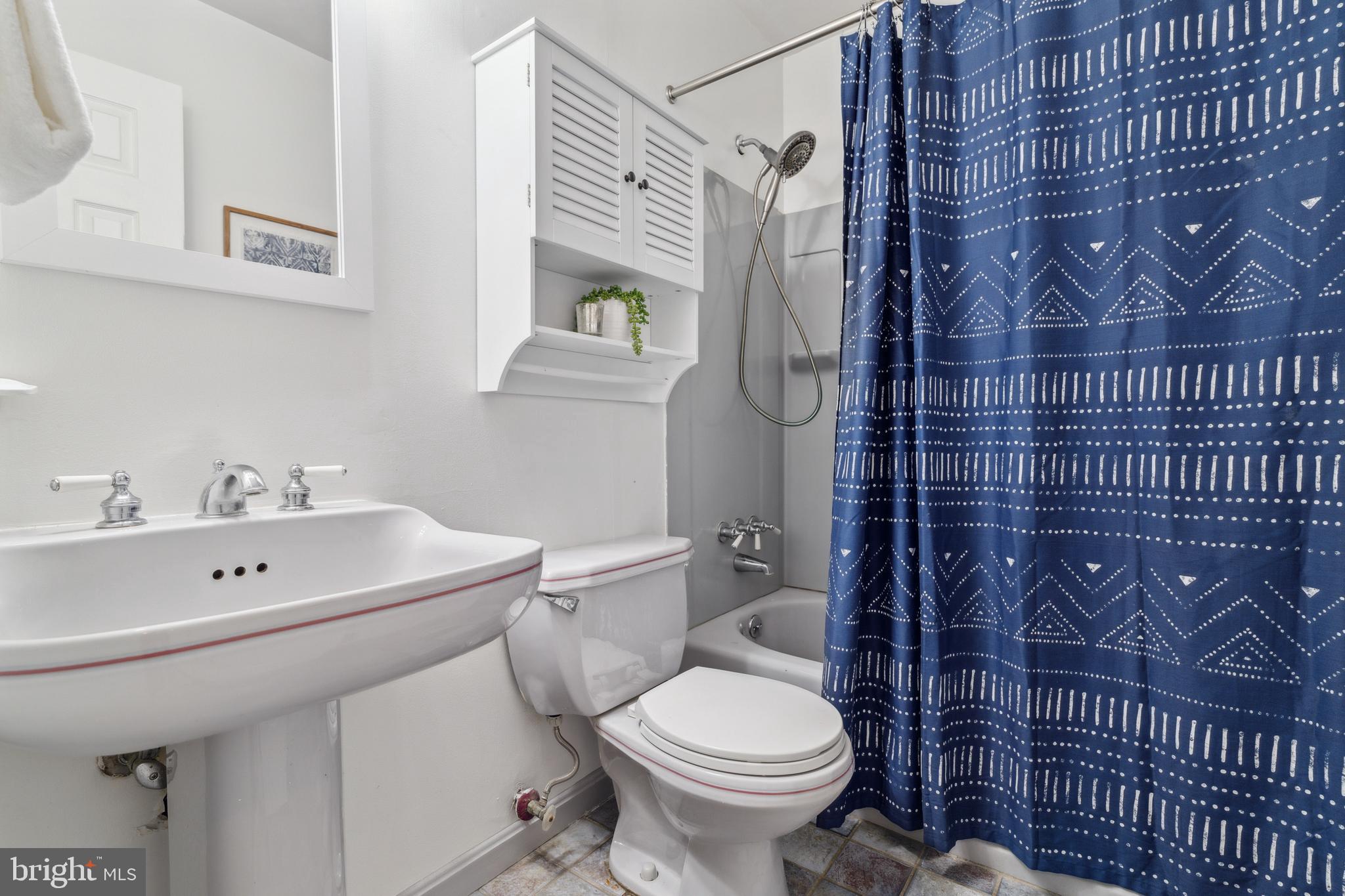 698 Benfield Road Severna Park, MD 21146 - Photo 15 of 28 a bathroom with a sink a toilet and a shower