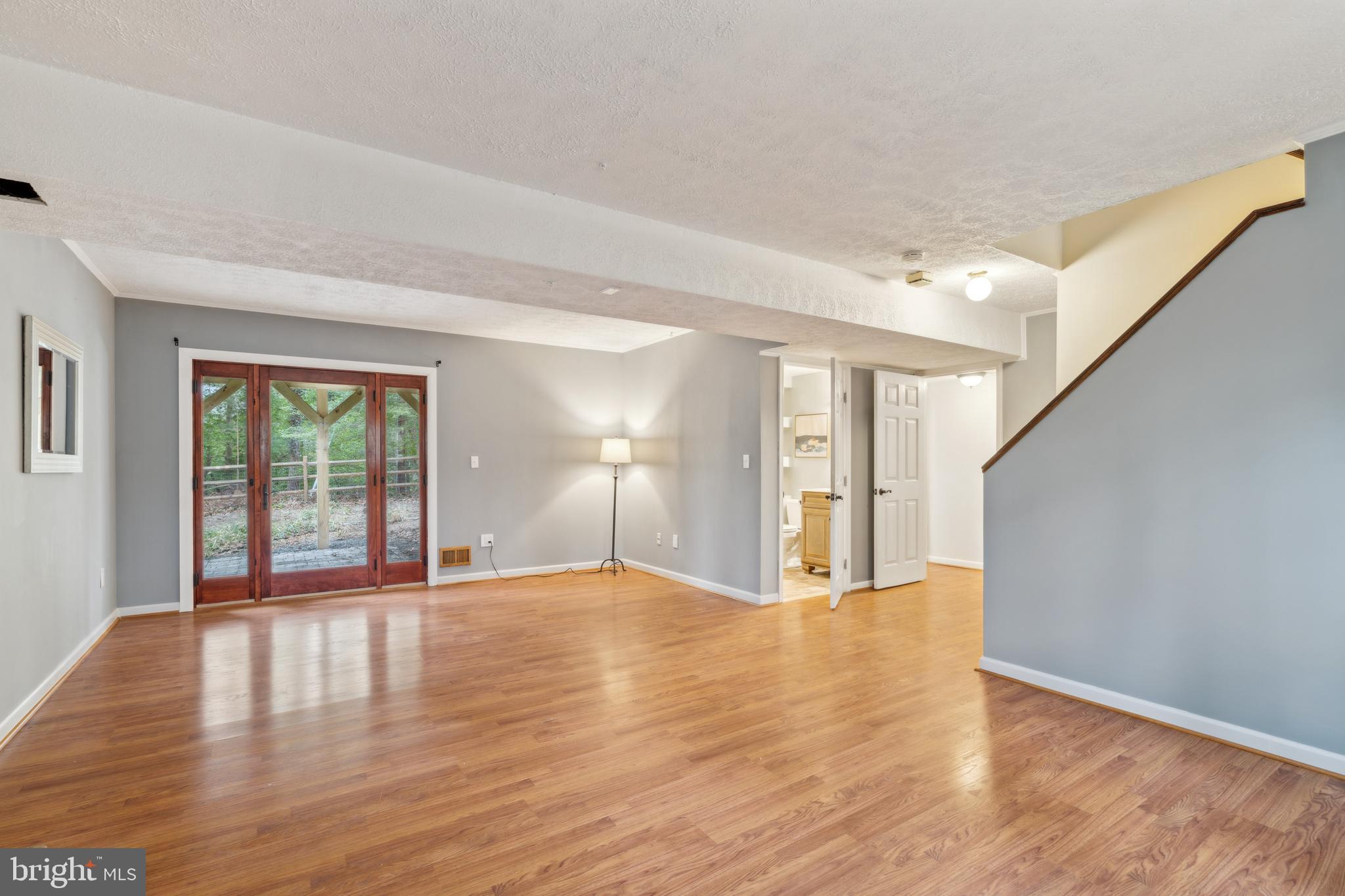698 Benfield Road Severna Park, MD 21146 - Photo 18 of 28 a view of an empty room with wooden floor and a window