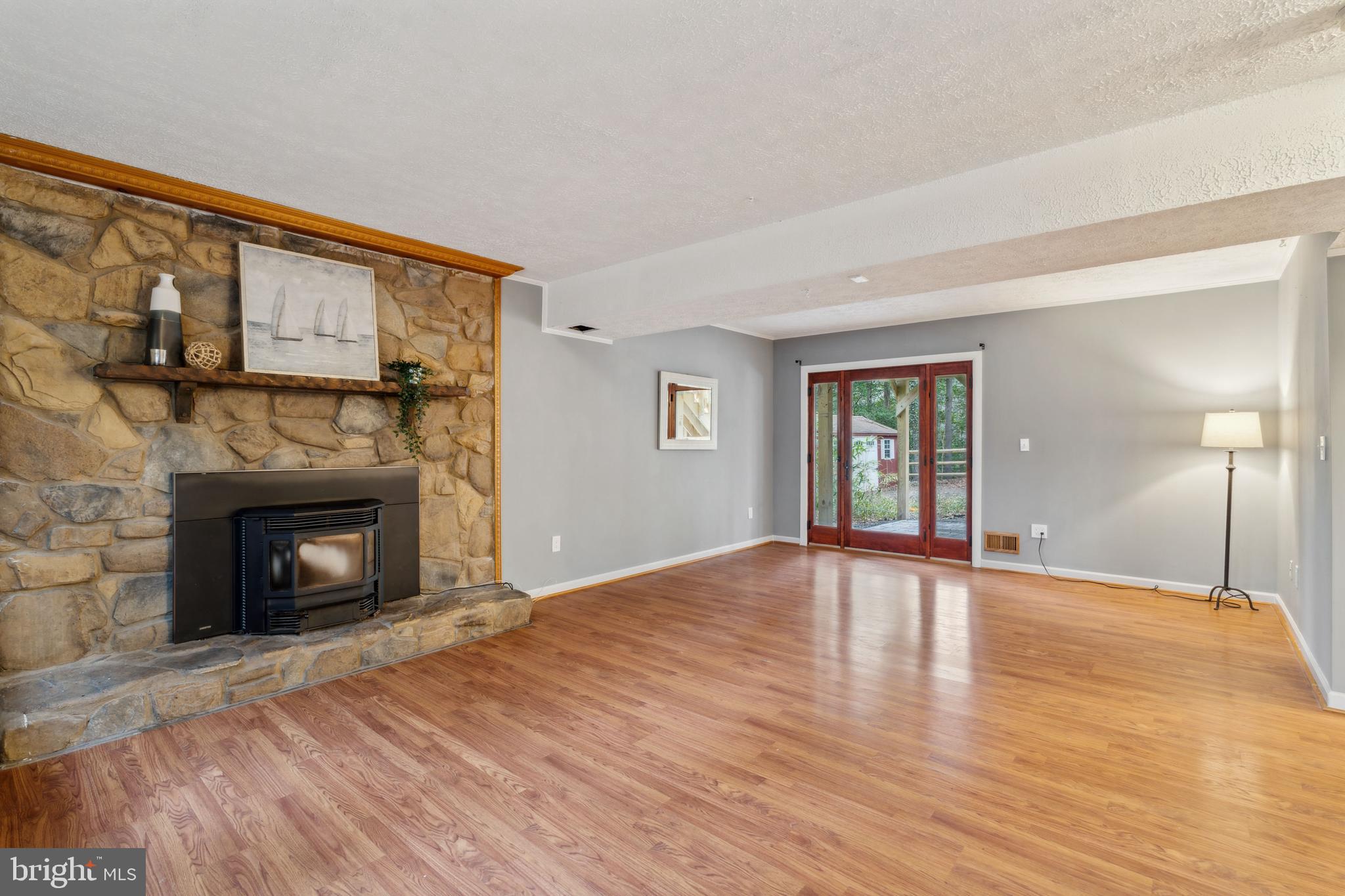 698 Benfield Road Severna Park, MD 21146 - Photo 19 of 28 a view of an empty room with a fireplace and a window