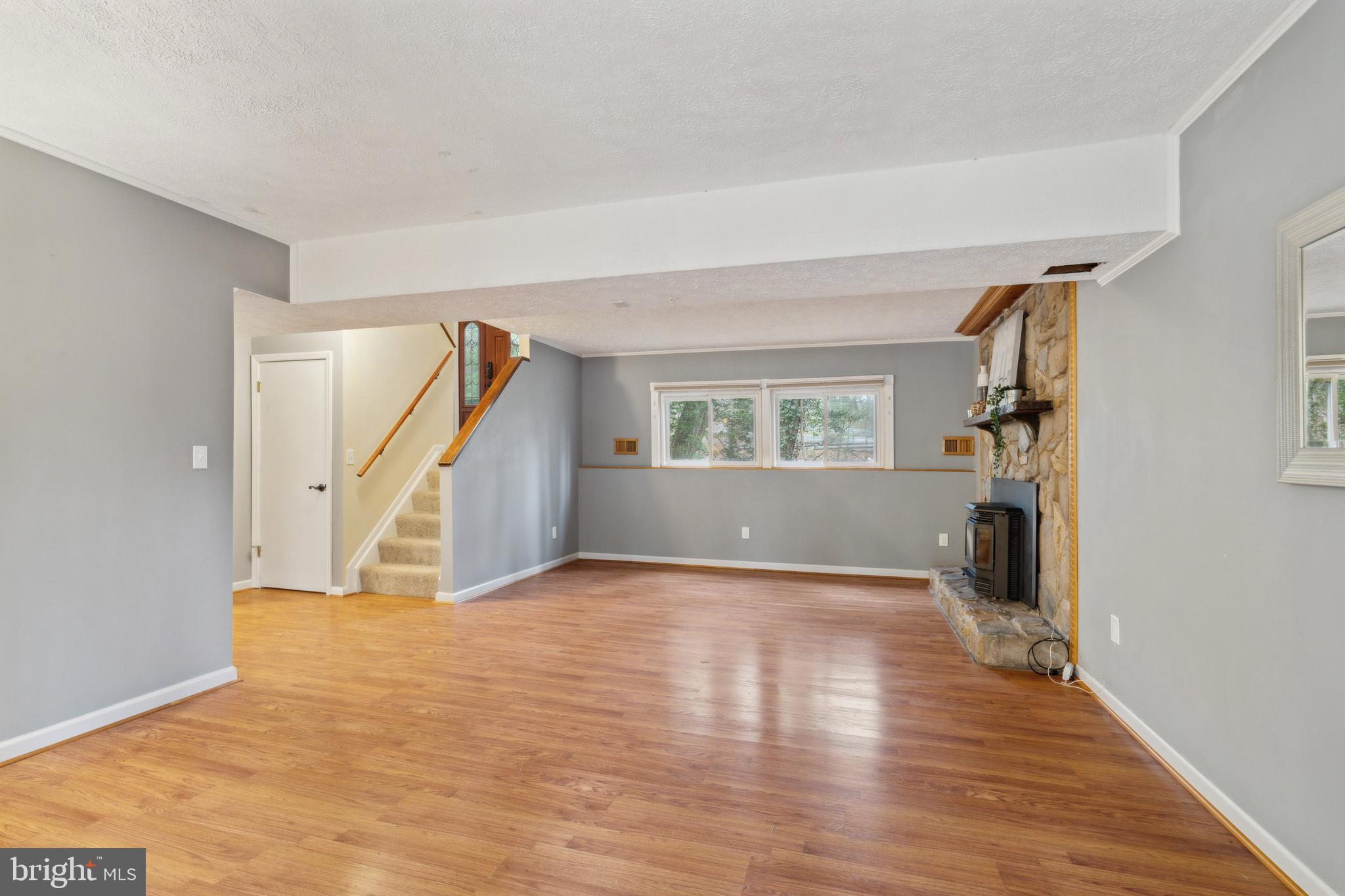 698 Benfield Road Severna Park, MD 21146 - Photo 20 of 28 a view of empty room with wooden floor and stairs