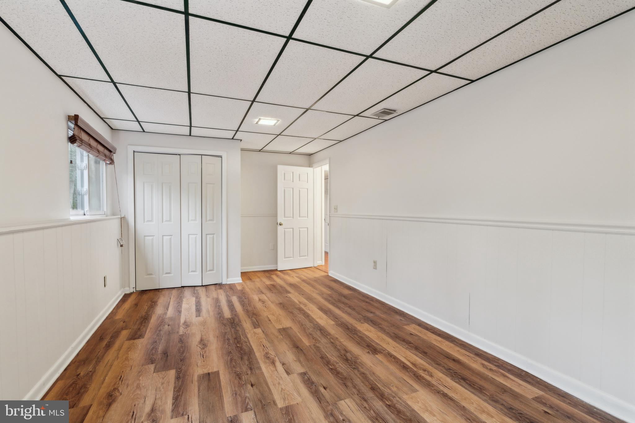 698 Benfield Road Severna Park, MD 21146 - Photo 22 of 28 a view of empty room with wooden floor and cabinet